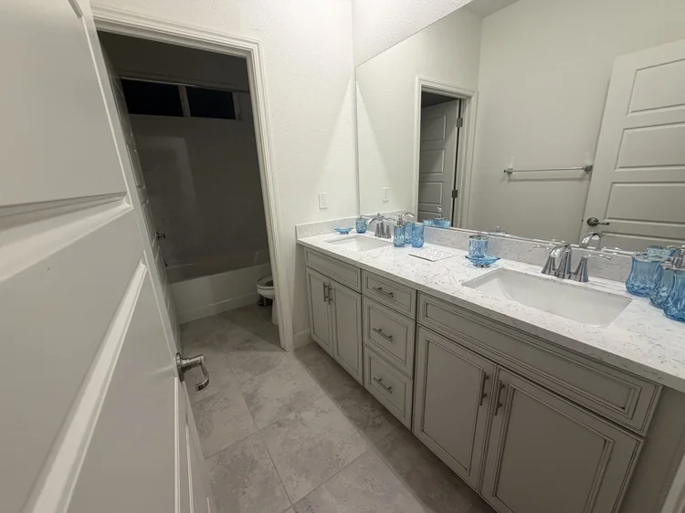 A double vanity in a shared upstairs bathroom.