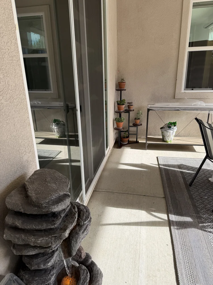 A stacked-stone fountain beside the patio.